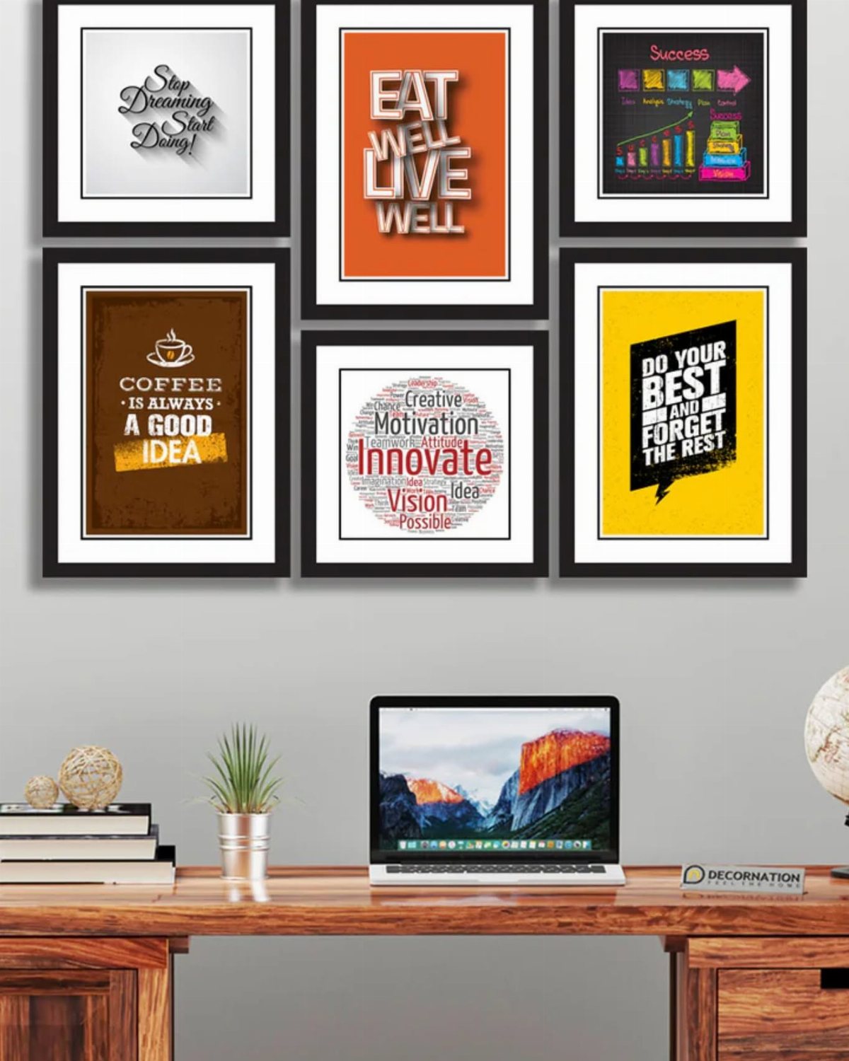 Six black framed motivational art prints hanging on a wall above a wooden desk with a laptop.