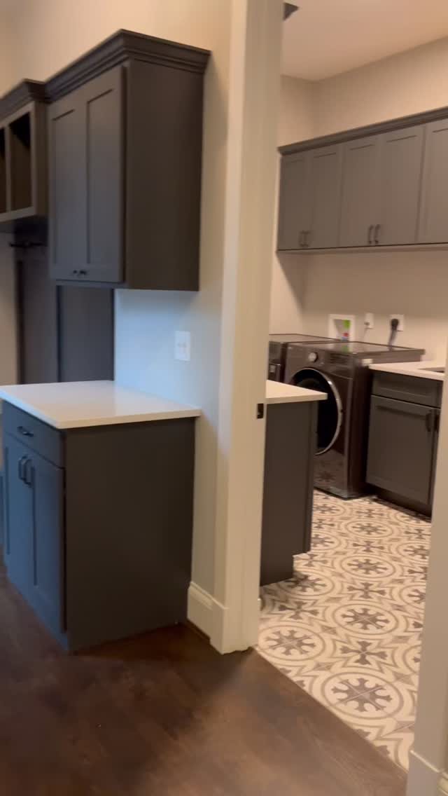 17 Laundry Room Ideas for Storage, Style and Smarter Layouts 17 Patterned grey and white tiles cover the floor of a modern laundry room.