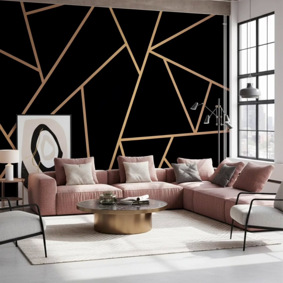 A living room with a black and gold geometric patterned accent wall and pink sofa.