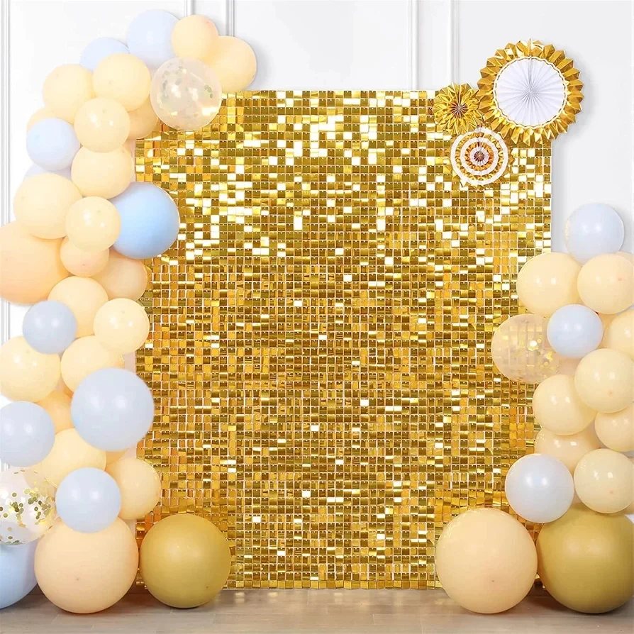 Gold sequin backdrop framed by pastel peach and light blue balloon garlands.