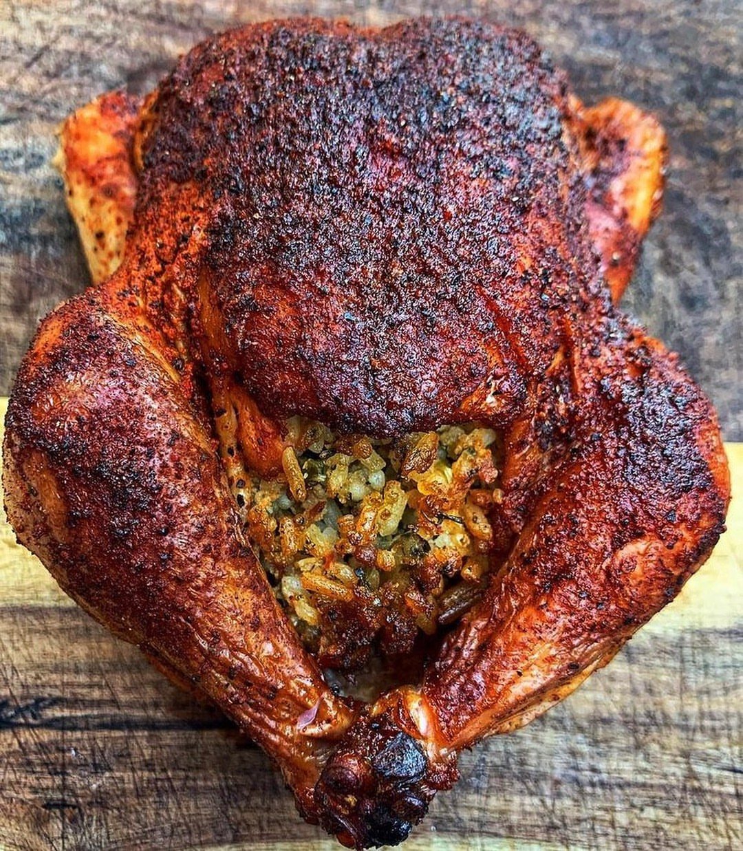 28 Easy Christmas Eve Dinner Ideas: From Slow Cooker Ham to Wreath Pizza 8 Roasted stuffed bird with seasoned crispy skin served on a rustic wooden board.