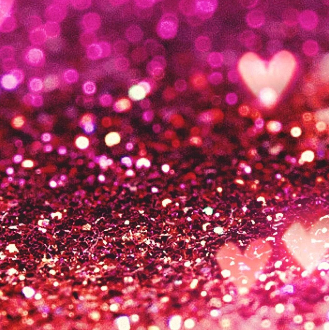 9 Hot Pink Background Ideas for Phones and Walls 2 Sparkling hot pink glitter texture with glowing white hearts and bokeh light effects.