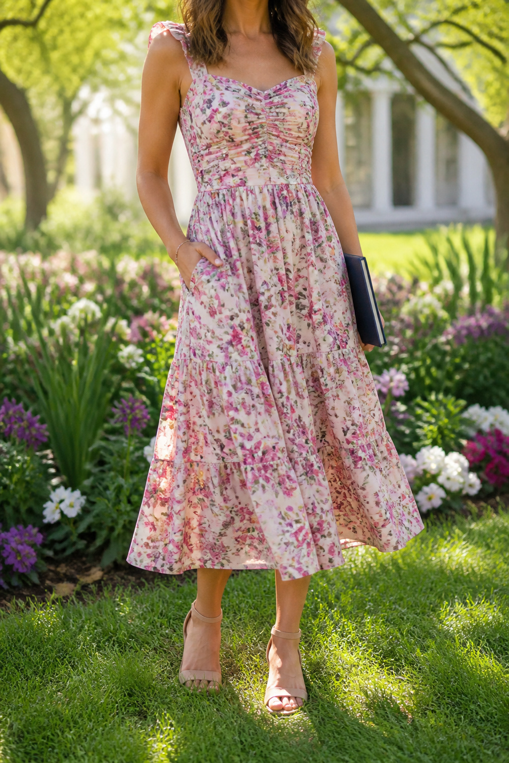 A woman wearing the Evereve Floral Midi Dress in a field of flowers.