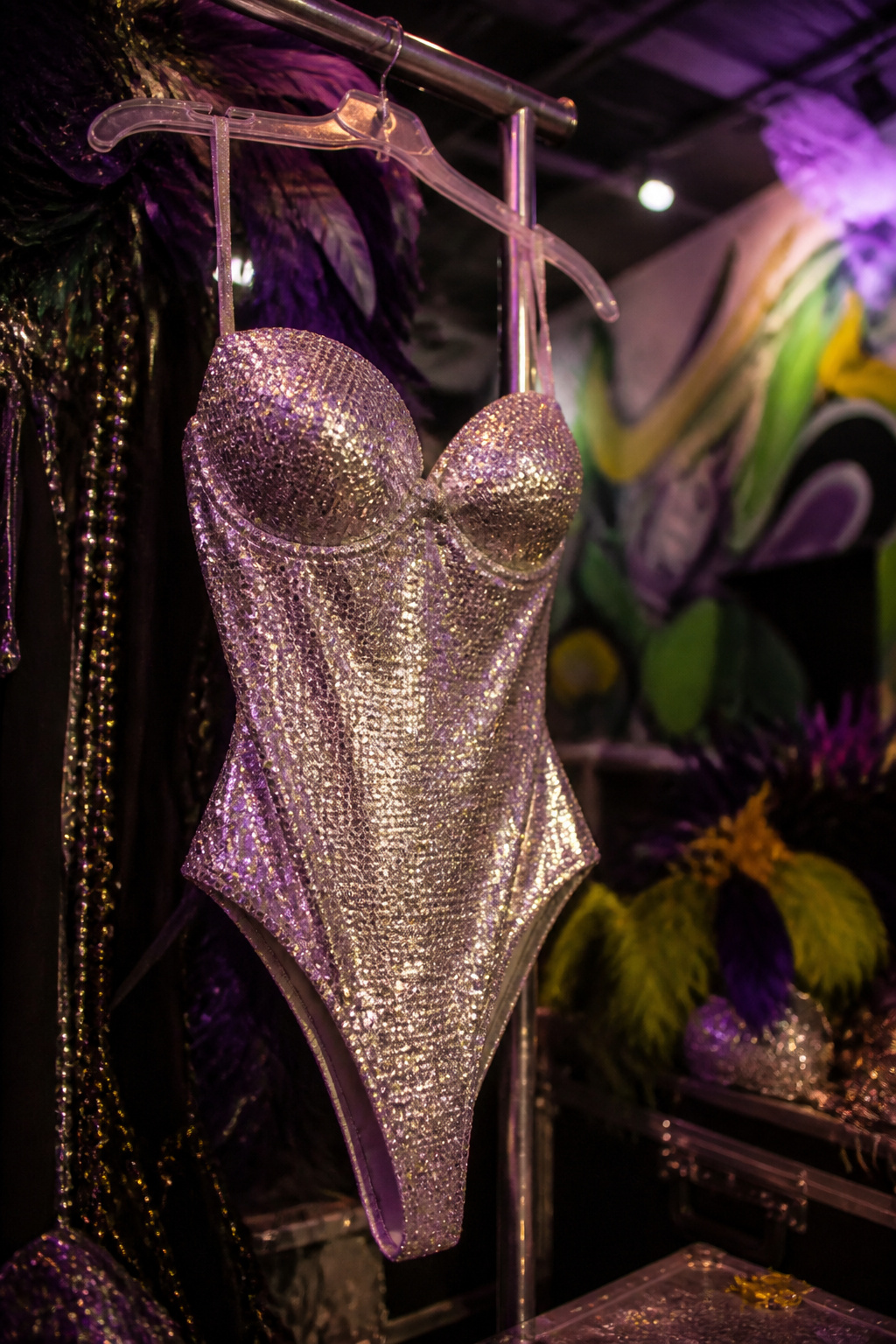 Silver sweetheart sequin bodysuit displayed on a flat surface.