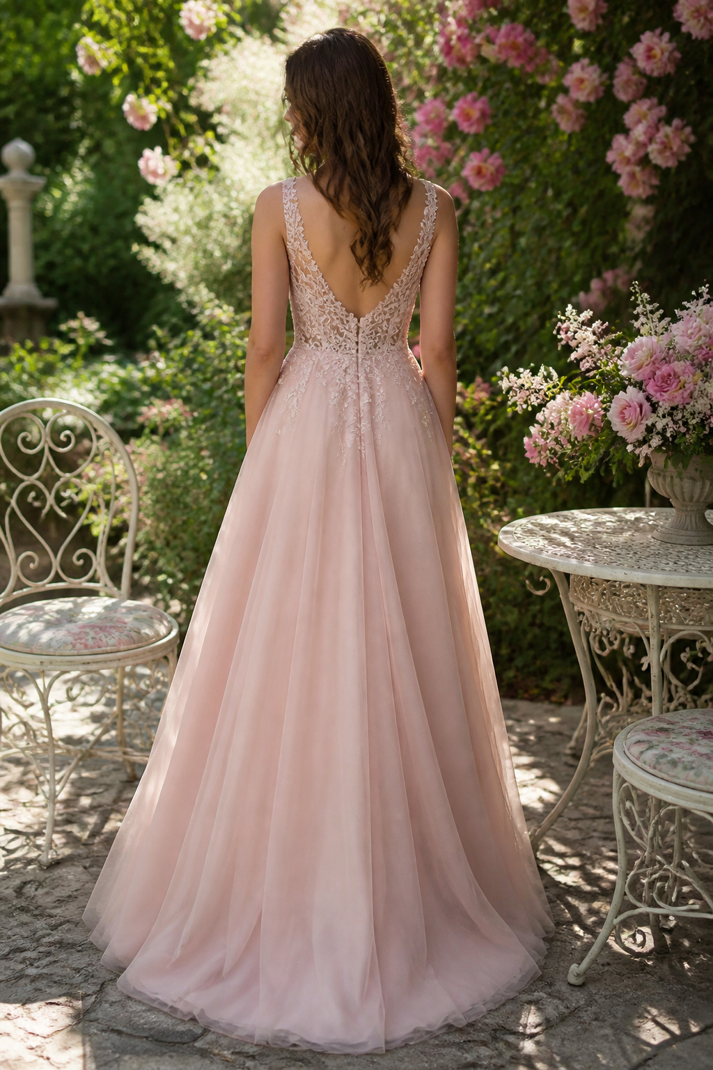 A soft blush A-line gown with subtle embroidery on the bodice.