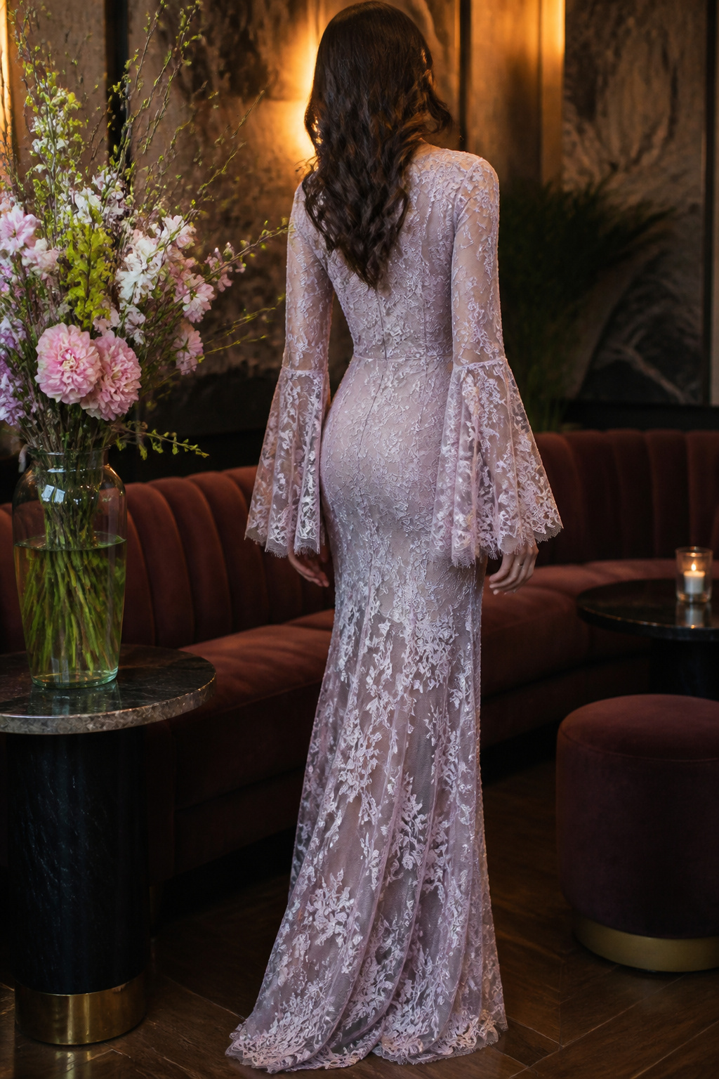 A long-sleeve dress made of sheer illusion lace with bell sleeves.