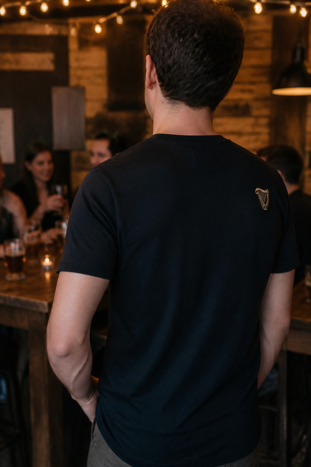 Guinness tee worn in a social setting with friends.