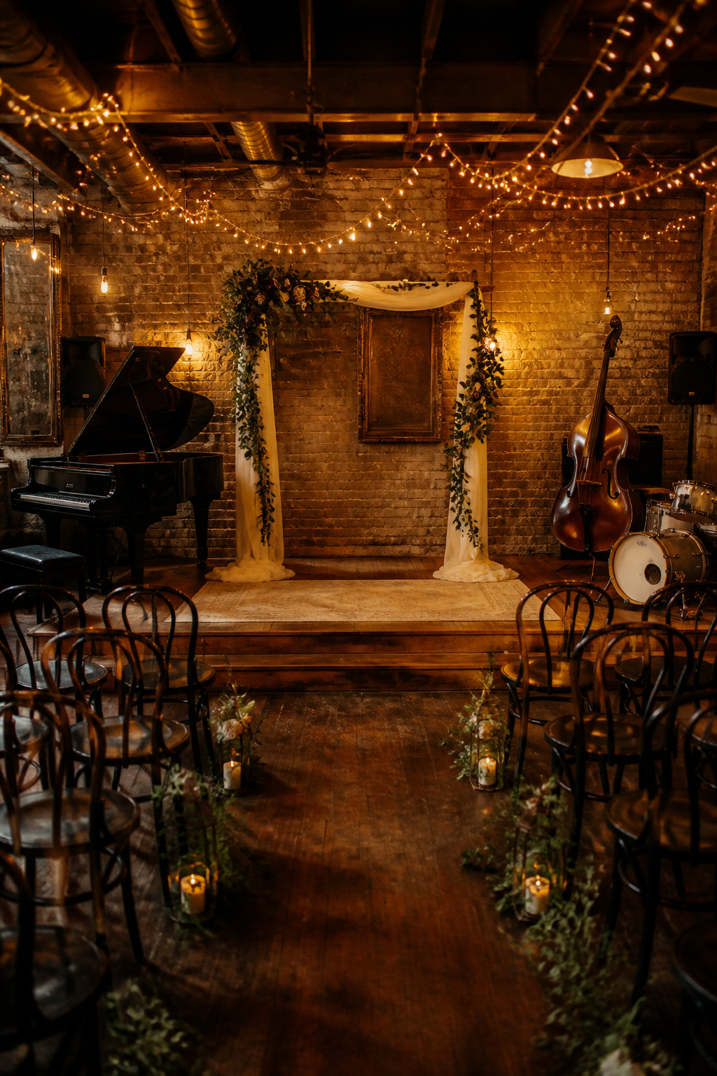 Intimate ceremony space with warm lighting and vintage decor.