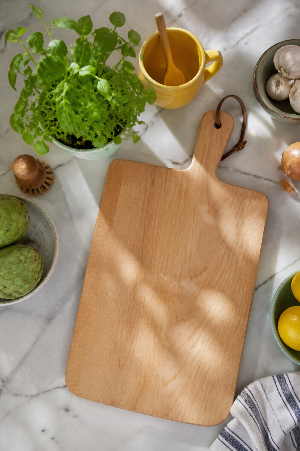 10 Spring Kitchen Decorating Ideas for a Fresh, Light Space 5 Cutting board with a potted herb and a colorful mug.