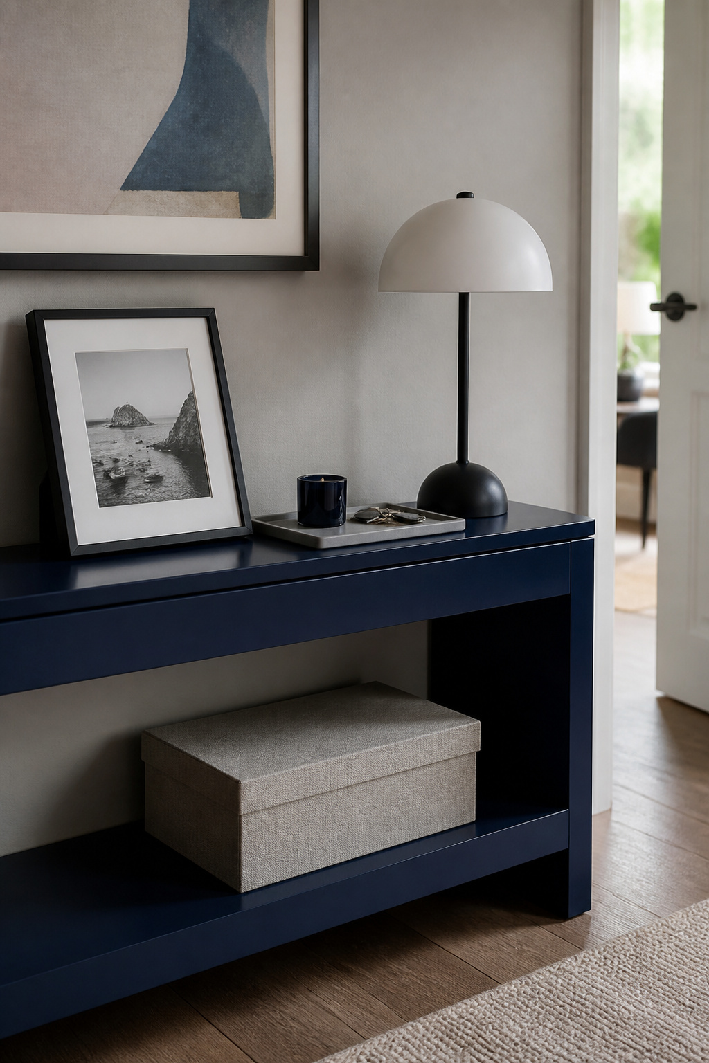 A framed photo and a souvenir displayed on a console table.