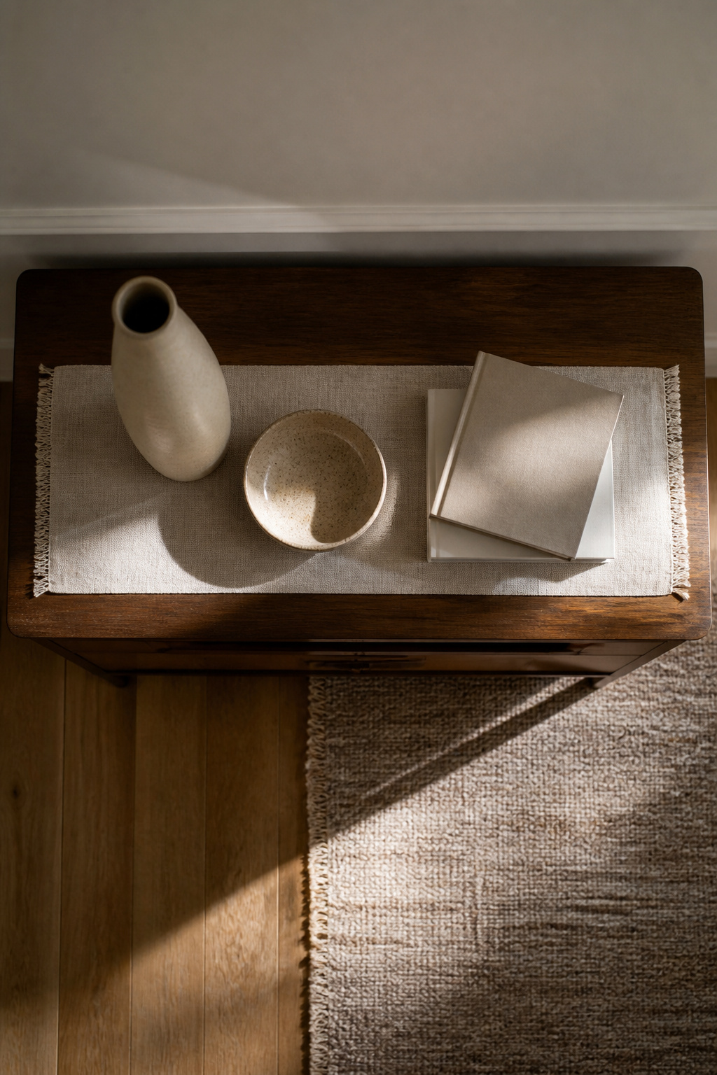 Three decorative items arranged on a console table.