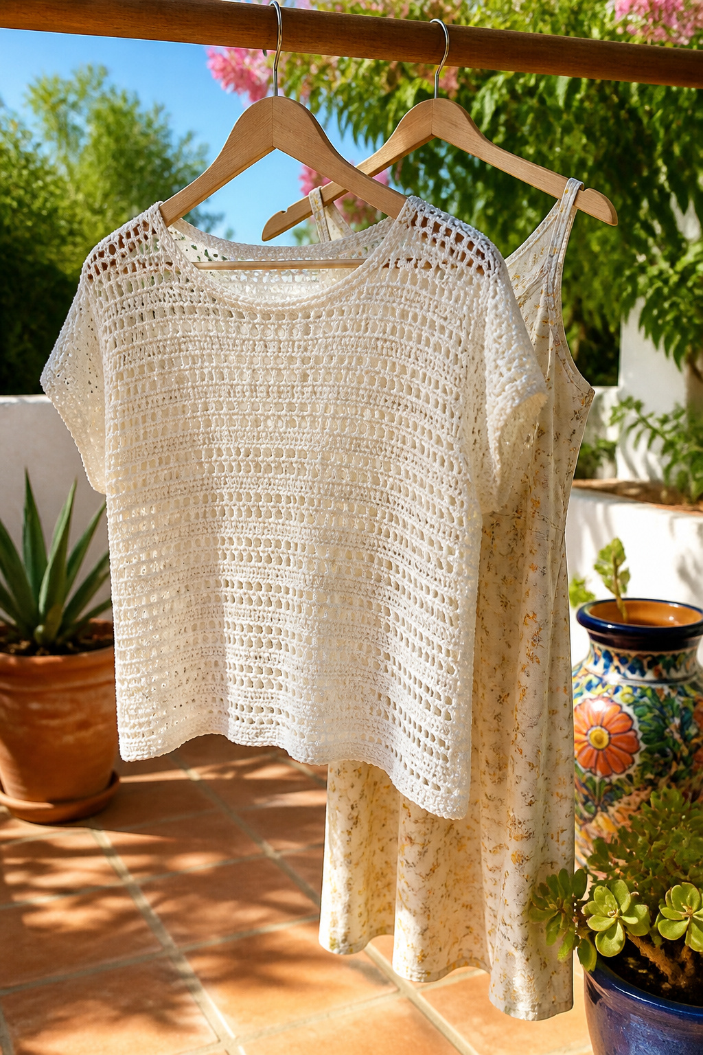 Crochet Summer Top Patterns, Styles and Yarn Guide 2 A Lacy Summer Top displayed on a terrace with greenery.