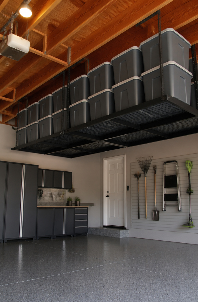 Ceiling racks in a garage used for overhead storage.