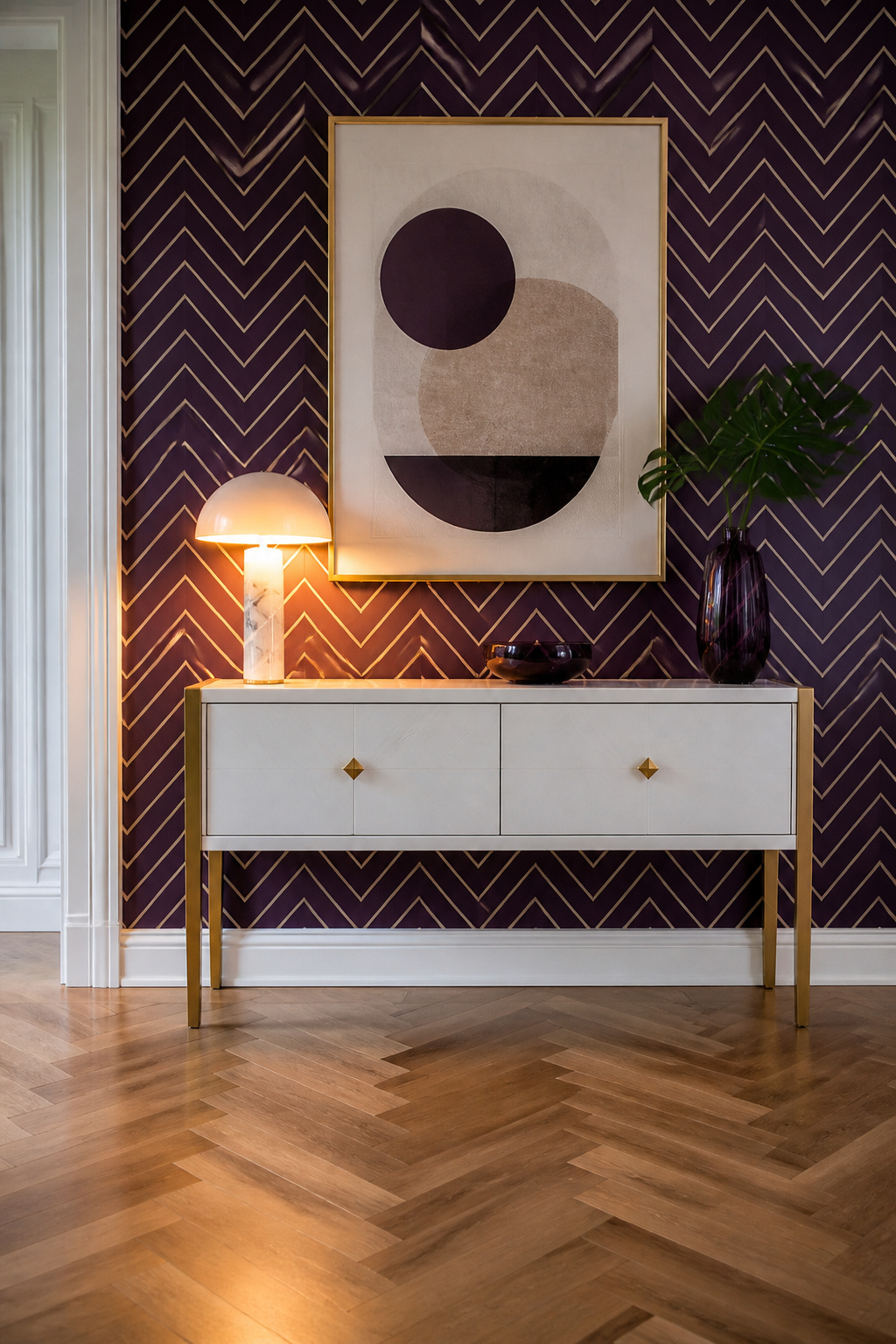 Art Deco Interior Design: Origins, Materials and 6 Defining Elements 3 Accent wall with bold chevron wallpaper and a white console table.