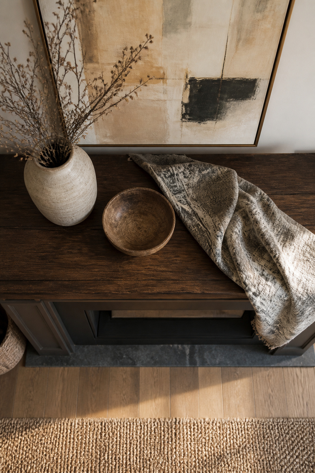 A grouping of decorative objects arranged in threes on a shelf.