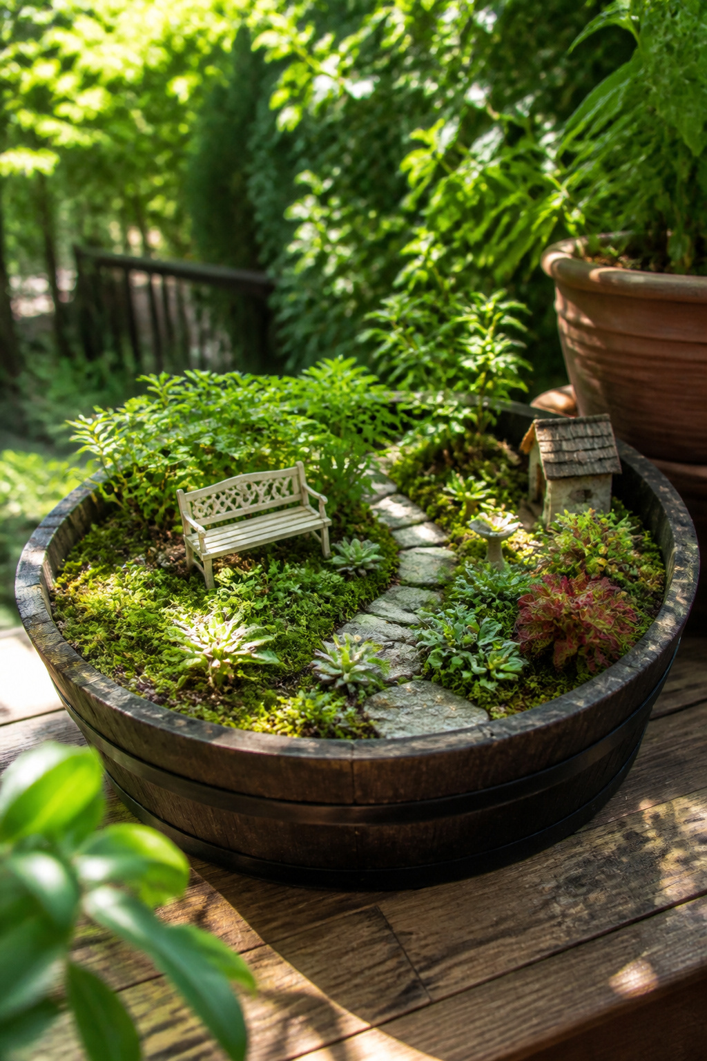 8 Barrel Planter Ideas for Flowers, Herbs, Vegetables & More 4 A half-barrel planter housing a fairy garden with small plants and decor.