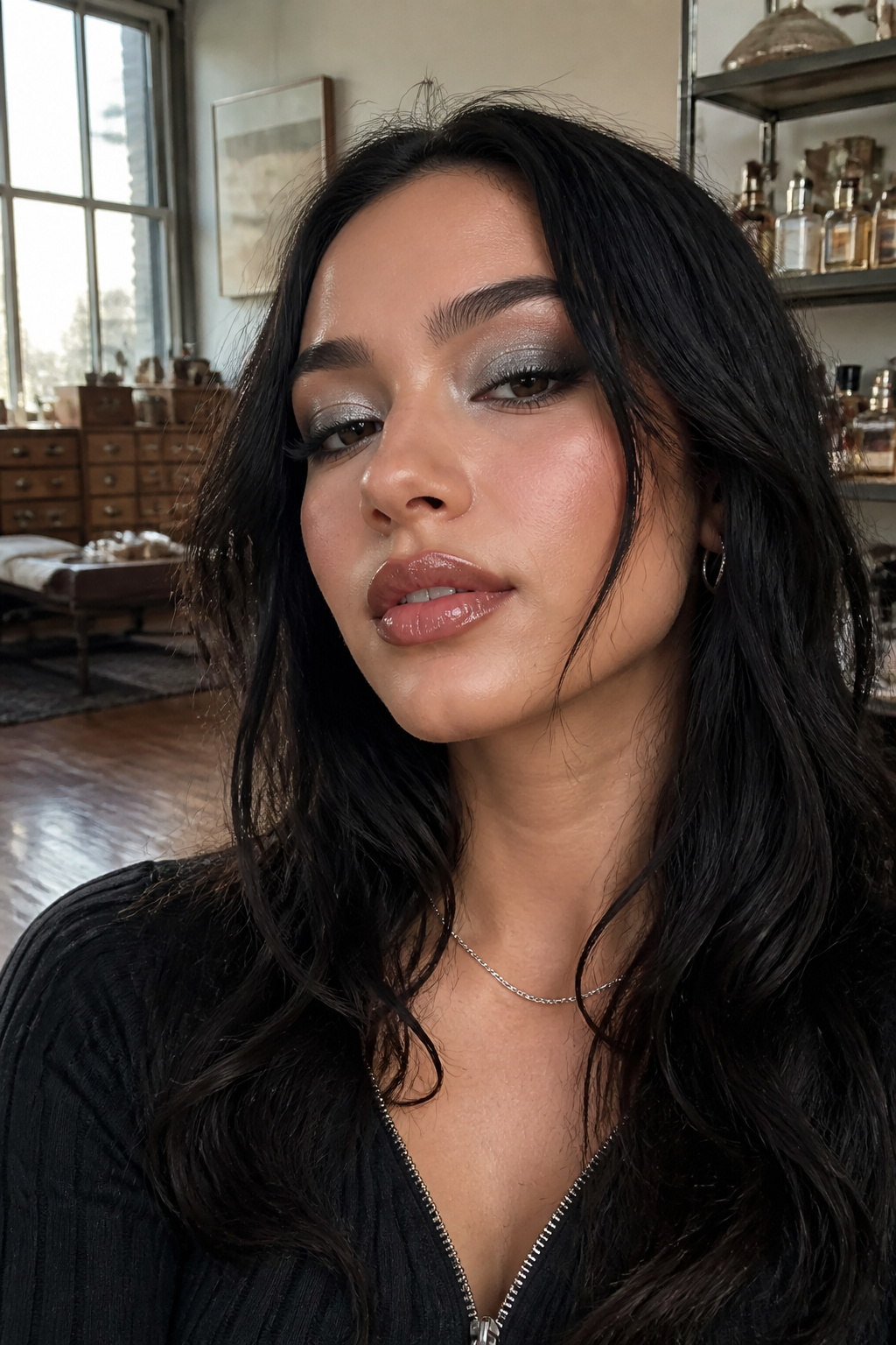 Close-up of Cassie's classic smokey eye makeup with silver shimmer.