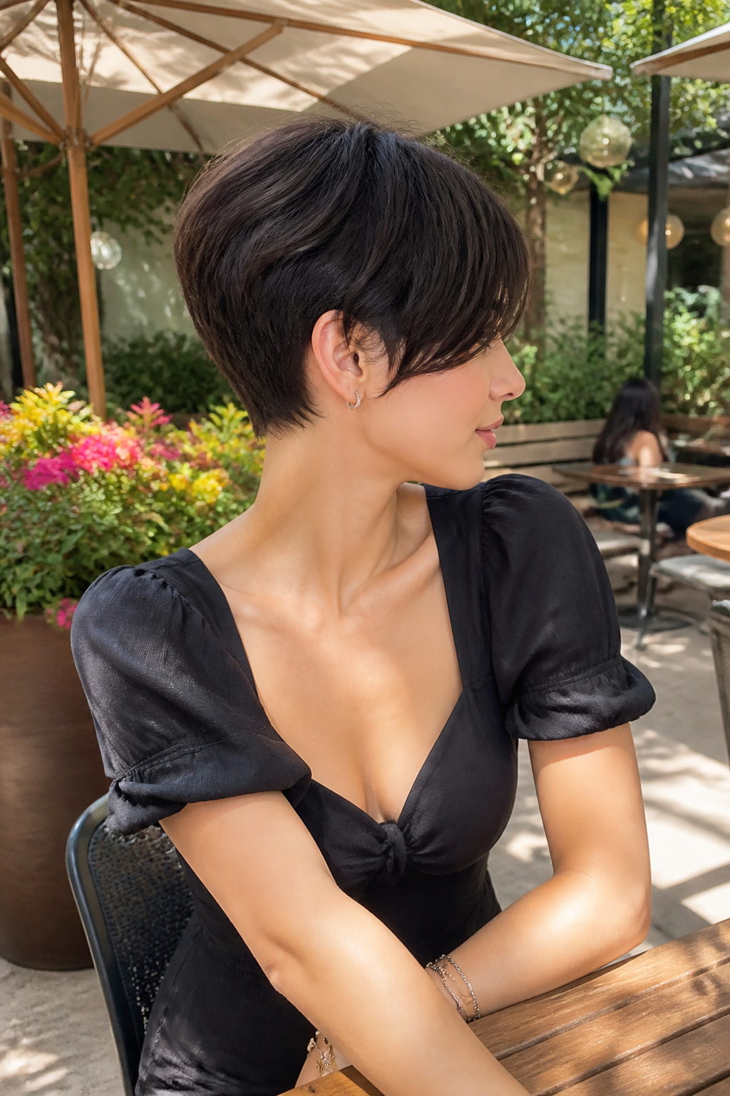 Short crop hairstyle with long bangs framing the face.
