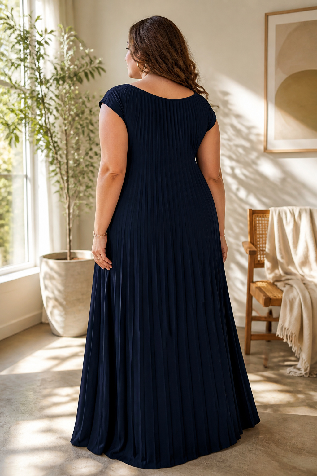Boatneck plisse cap-sleeve maxi dress shown in a casual setting.