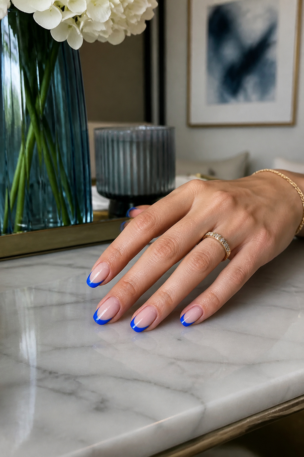 15 Blue Nail Ideas for 2026: Cobalt, Baby, Navy & More 7 Nails with blue French tips over a sheer pink base.