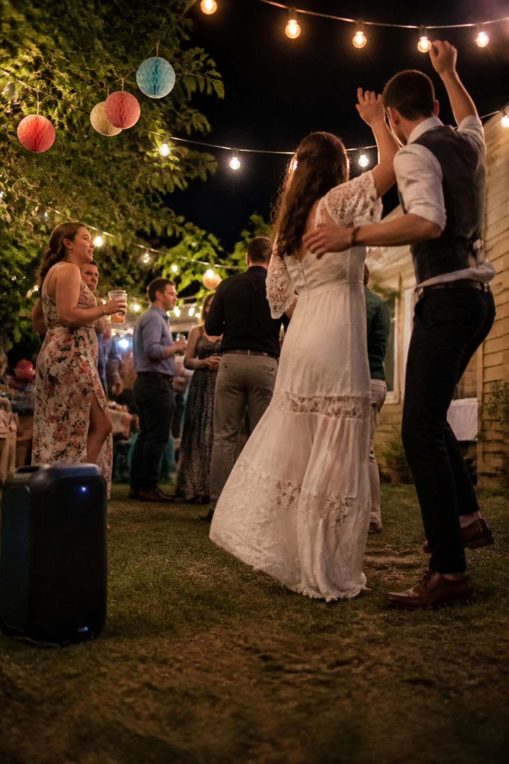 How to Plan a Budget Wedding in 2026: 10 Steps That Actually Work 15 A Bluetooth speaker set up for music at a wedding reception.