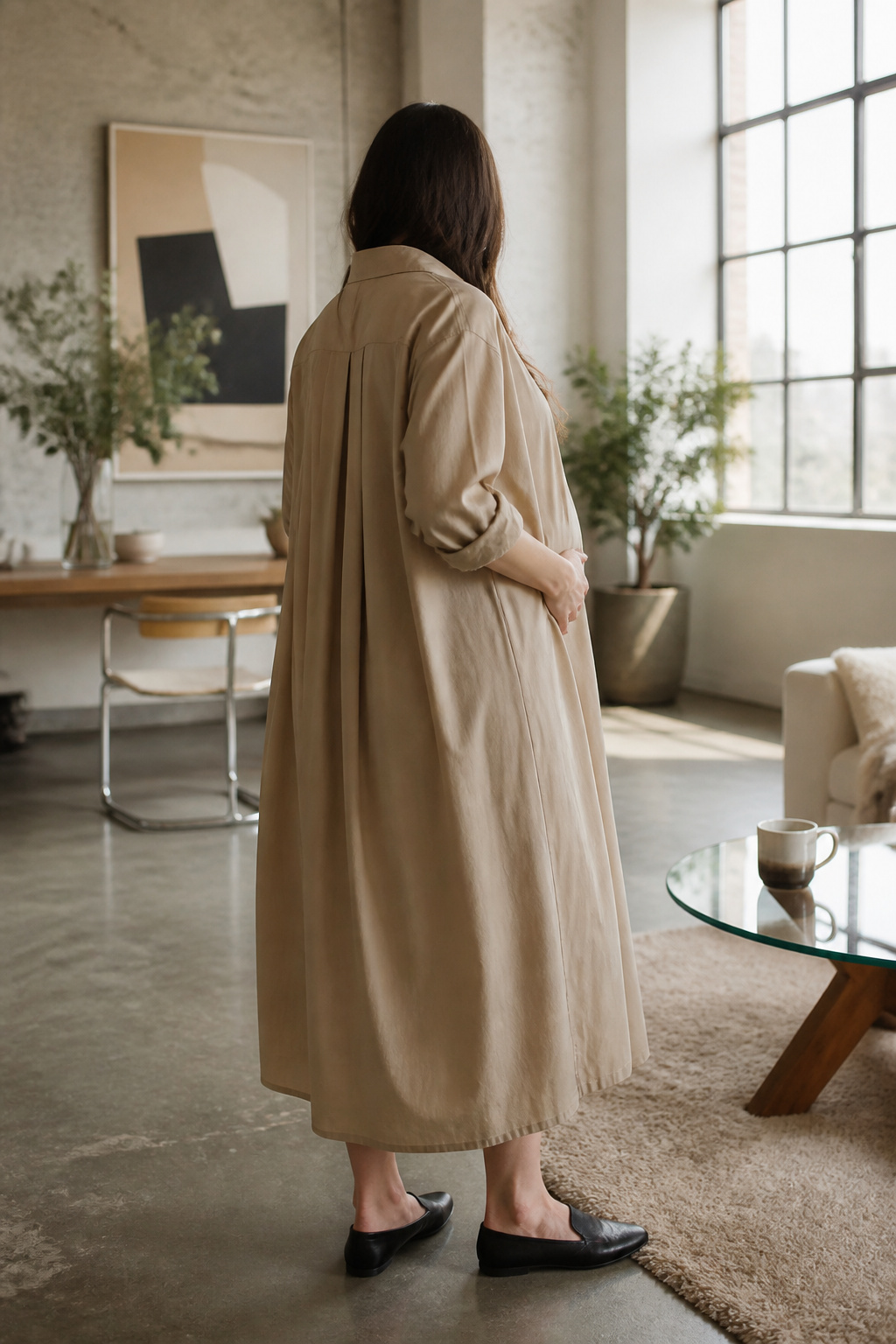 Model showcasing the Frankie Shop Calren Maxi Shirt Dress in a bright loft.