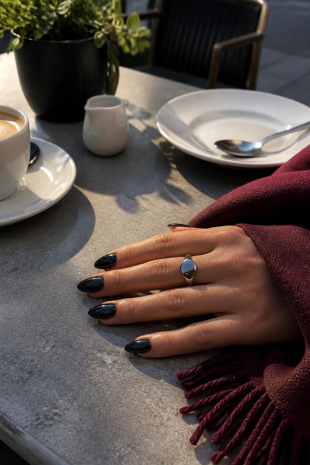 15 Fall Chrome Nail Ideas: Colors & Styles for 2026 5 Black chrome nails on a gray stone table with a burgundy scarf.