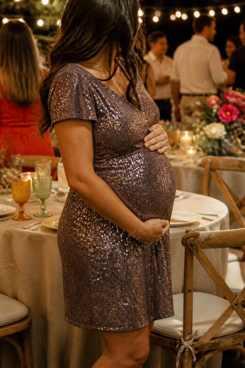 Maternity Dresses: Styles for Every Stage and Occasion 11 Expectant mother in a sequin party dress at an evening gathering.
