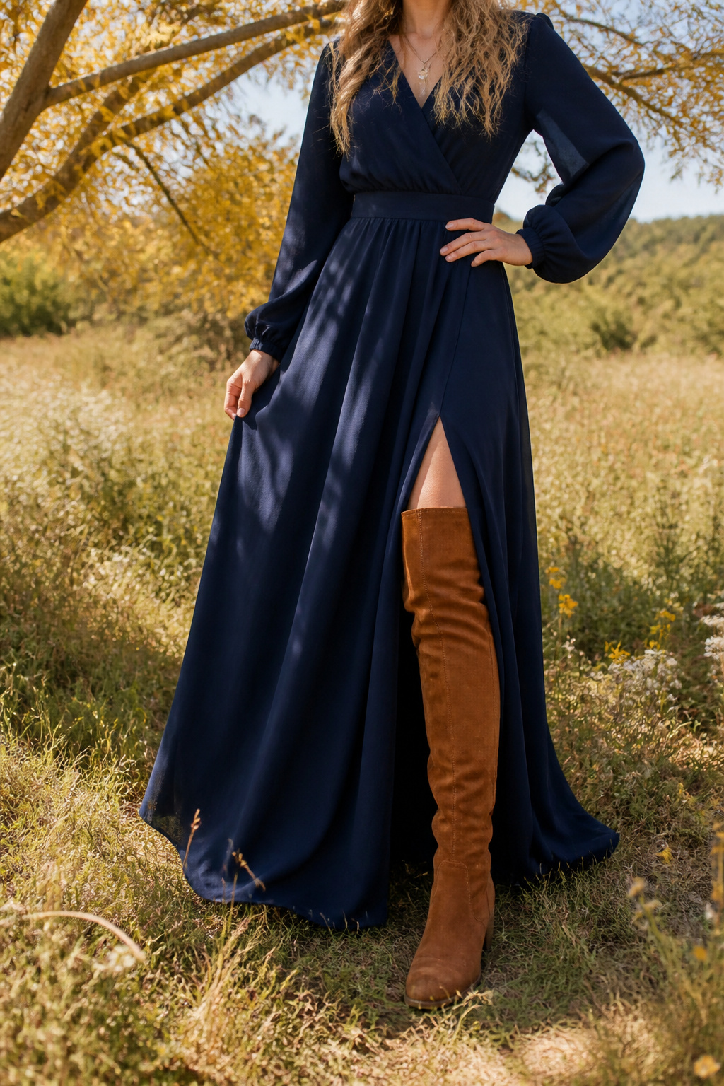21 Over the Knee Boot Outfits for 2026 4 Maxi dress flowing over cognac over-the-knee boots with a side slit.
