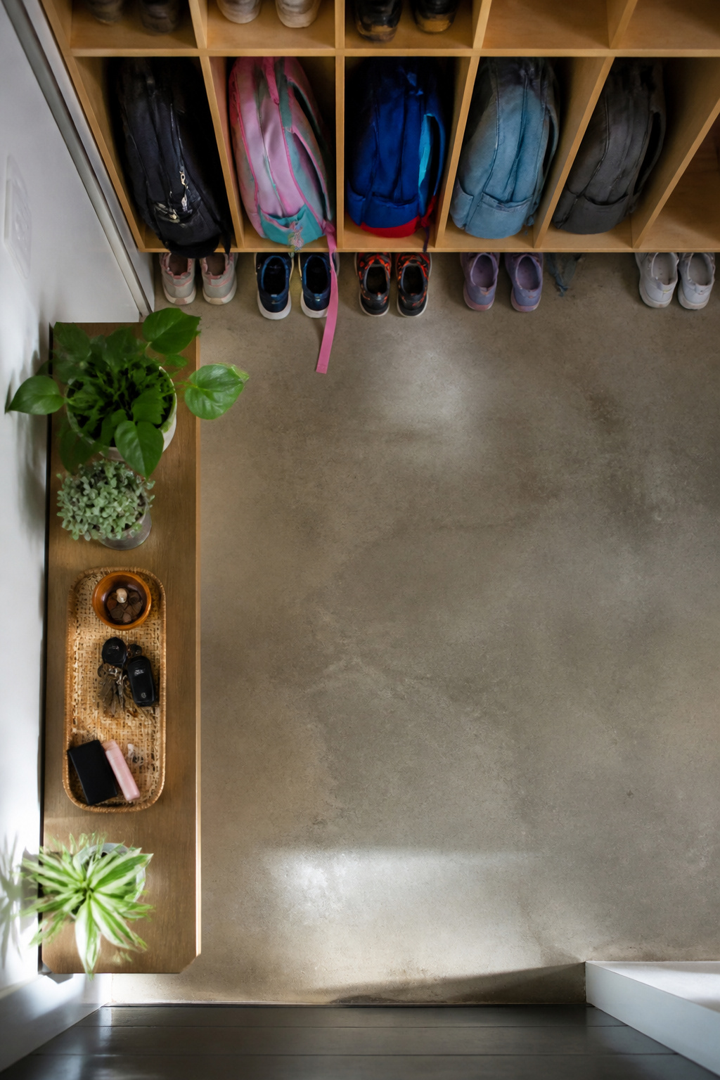 Garage Drop Zone: How to Plan and Build the Right Setup 2 A drop zone showing backpacks and shoes in organized storage.