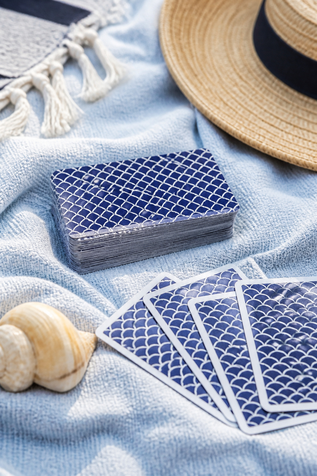 A deck of waterproof playing cards resting on a light fabric.