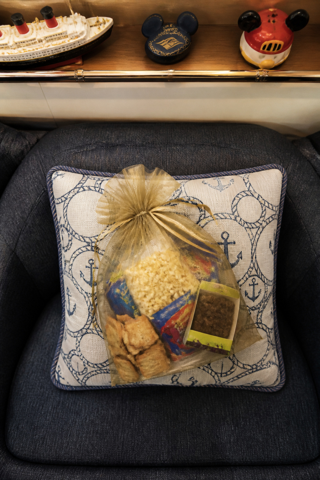 A bag filled with popcorn, crackers, and snacks for movie night.