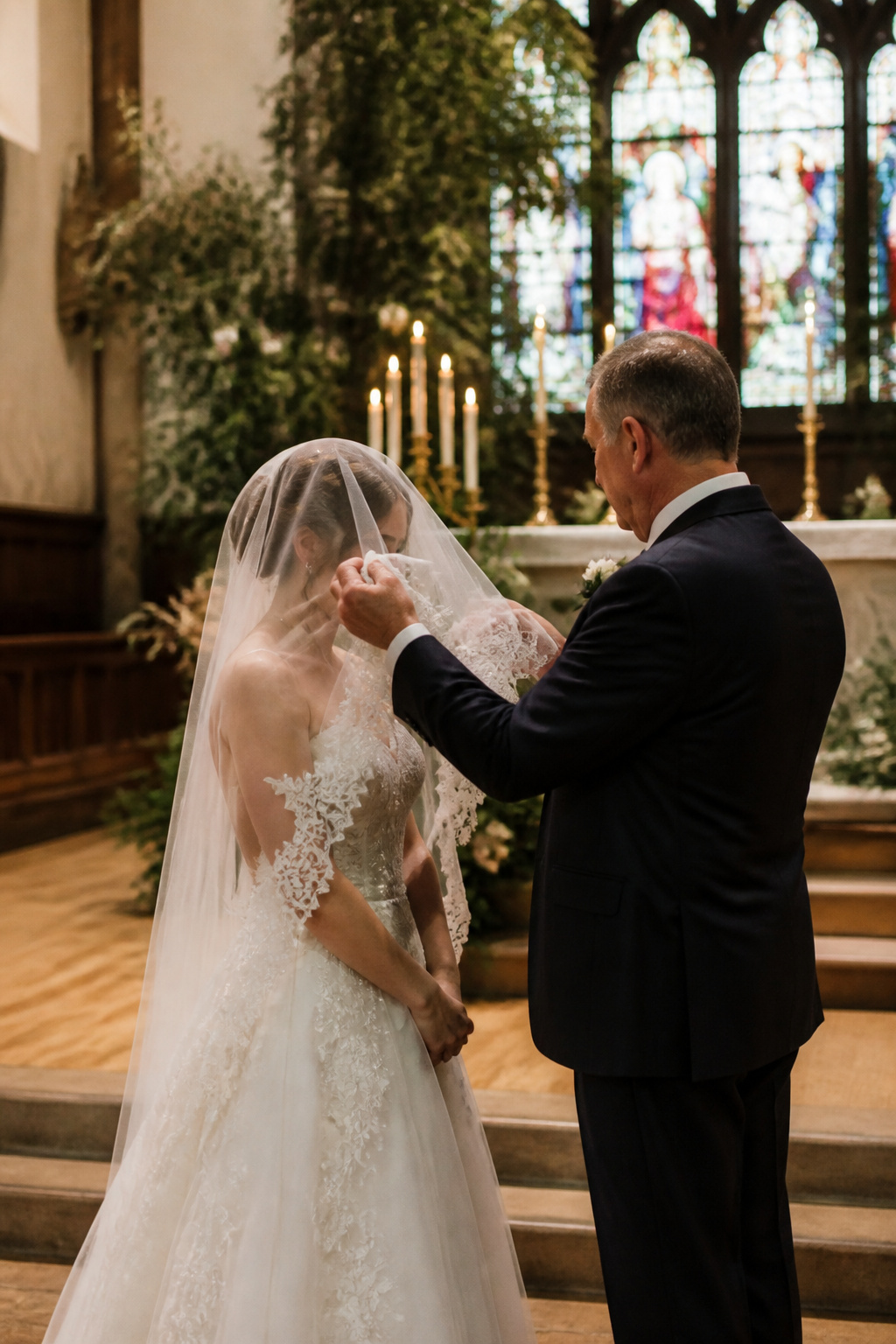 Christian Wedding Traditions: Meaning and History 2 Bride's father lifting her bridal veil at the altar.