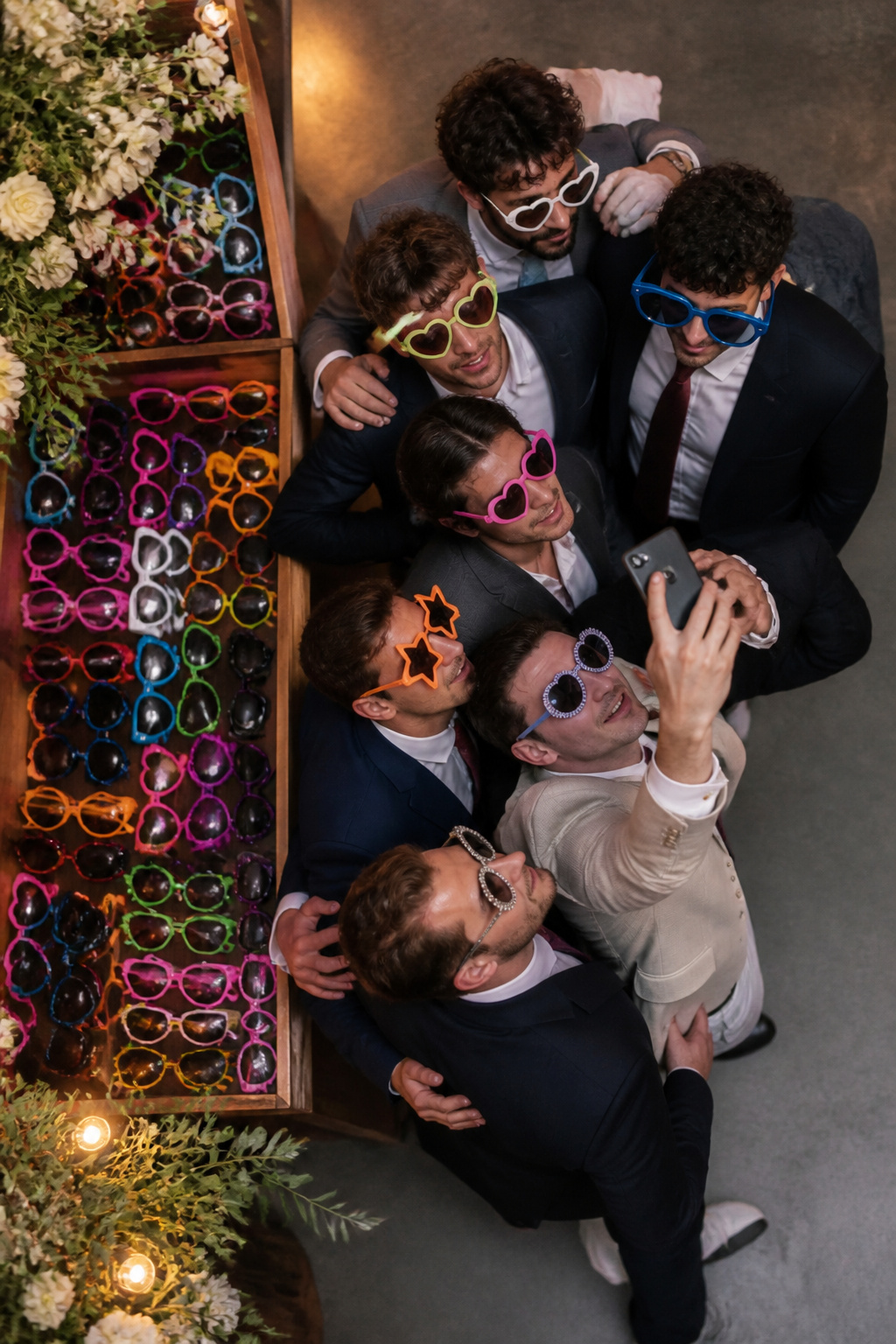 Guests wearing sunglasses during a wedding reception.