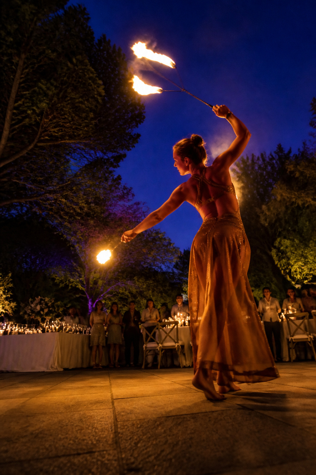 Fire dancer performing at a wedding reception.