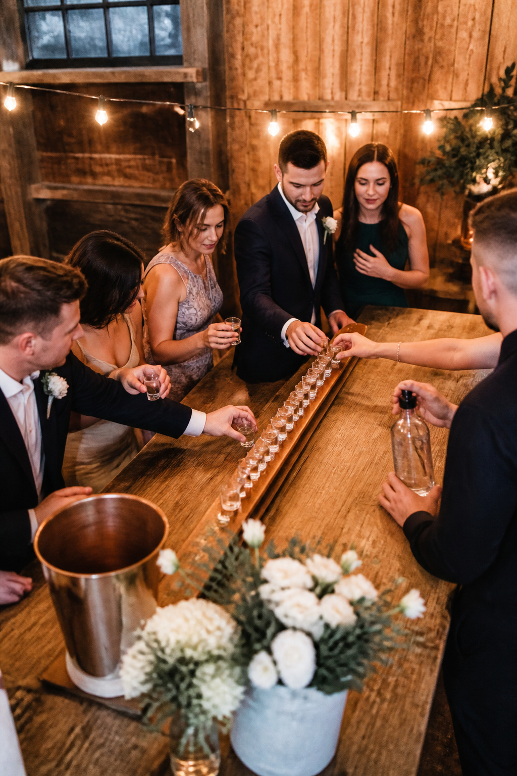 Vintage wooden ski with shot glasses at a wedding.