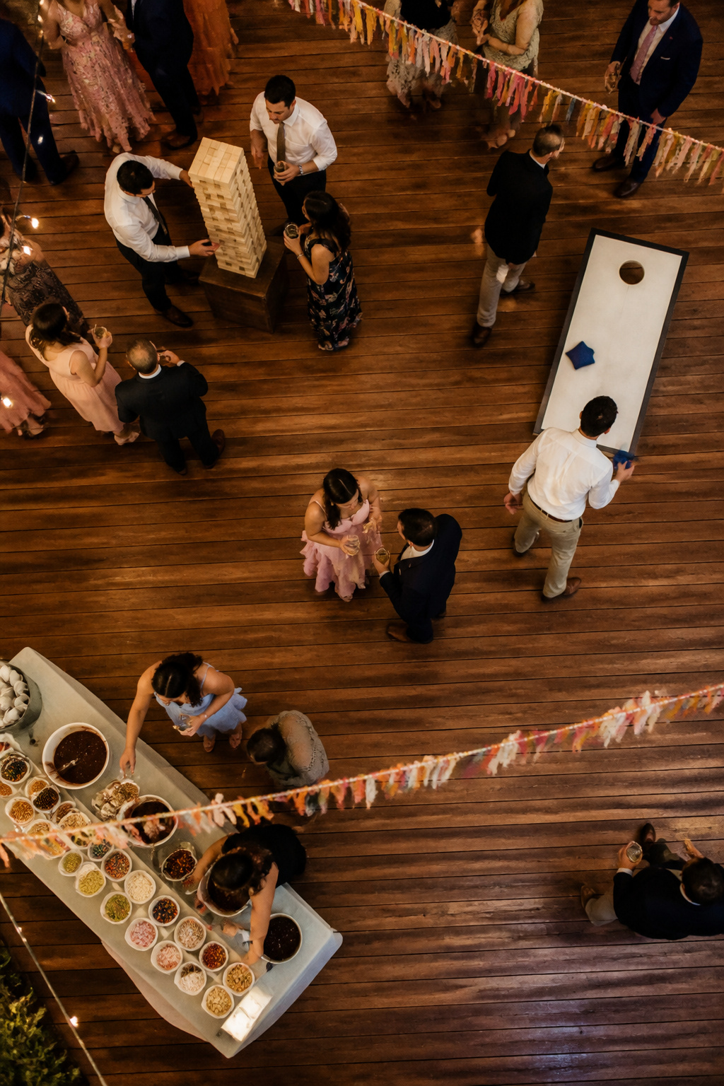 Guests playing lawn games at a wedding reception.