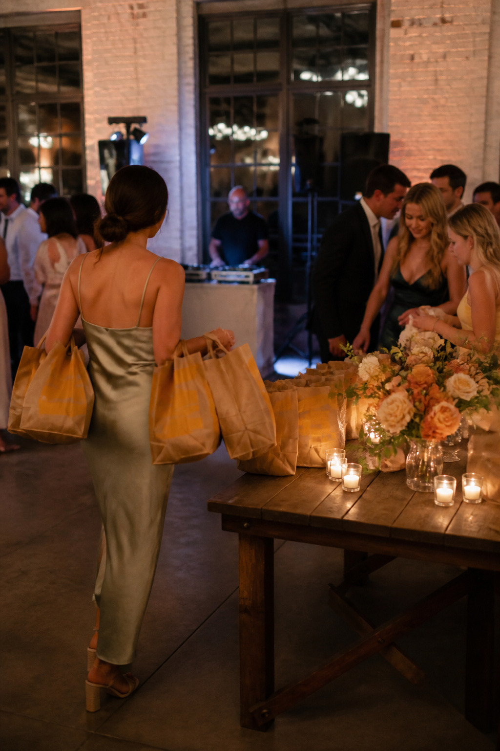 Friend carrying bags of McDonald's into a wedding reception.