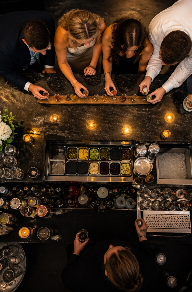 A ski shot setup with shot glasses and guests preparing to drink.