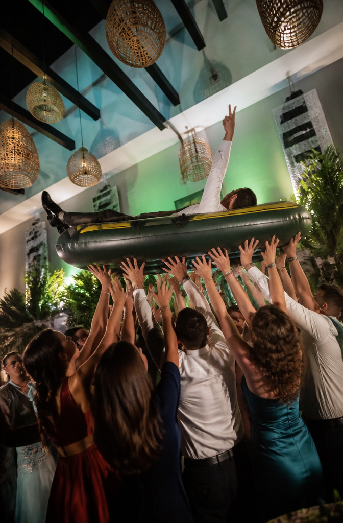 A guest crowd surfing during a wedding reception.