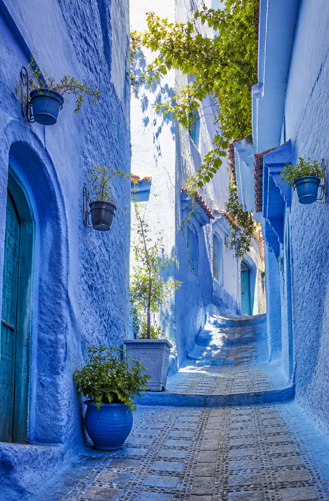 20 Cool Places Around the World: Global Spots for Your 2026 Trips 17 Narrow alleyways in Chefchaouen with blue-painted buildings.