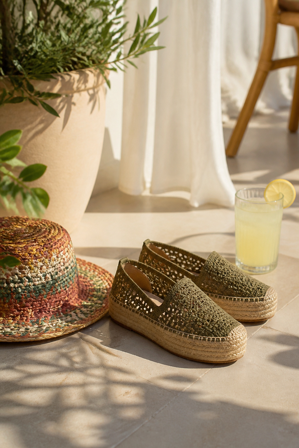 Payless Shoes Women's Styles: Boots, Heels, Sneakers & More 4 Pair of woven jute-soled espadrilles next to a summer hat on a patio.