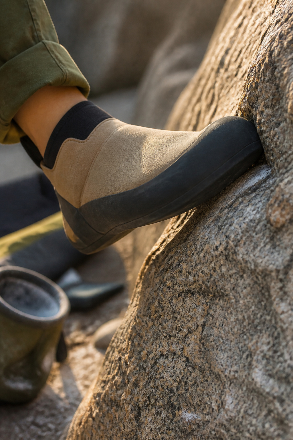 The Up Mocc climbing shoe with a smooth leather upper and rubber sole.