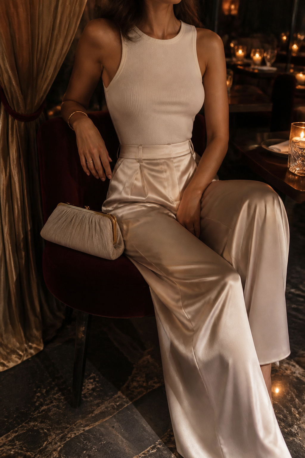 Model wearing satin wide-leg trousers and a fitted cotton bodysuit.