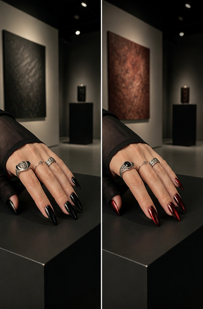 A hand with nails painted in various gothic colors.