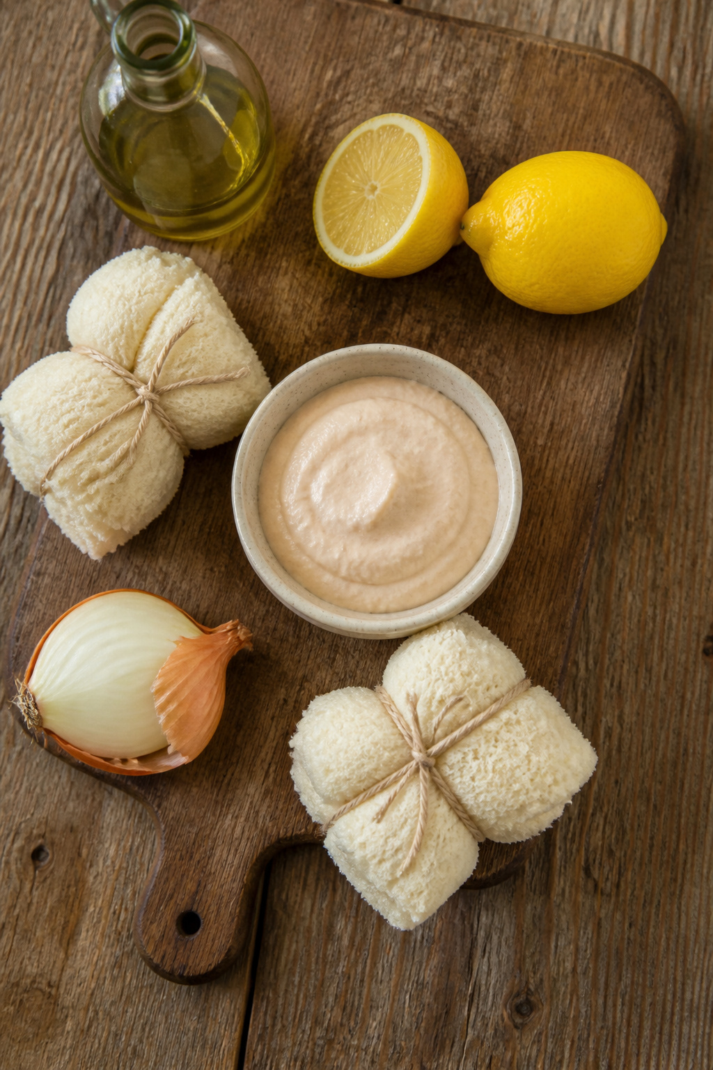 Ingredients for taramosalata displayed on a wooden table.