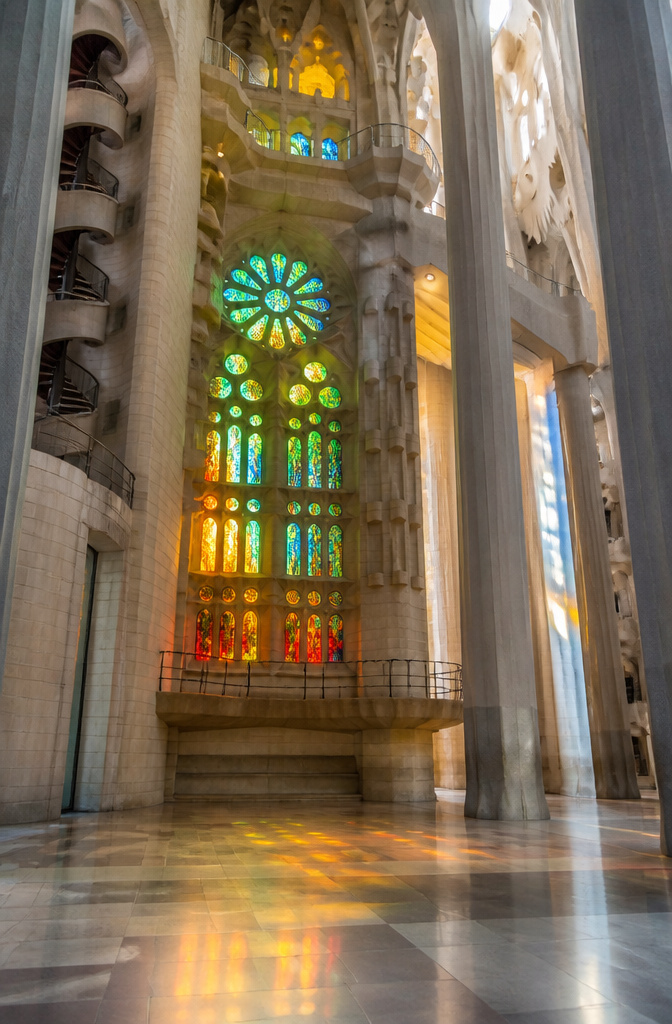 Abstract stained glass windows in La Sagrada Familia capturing colorful light.