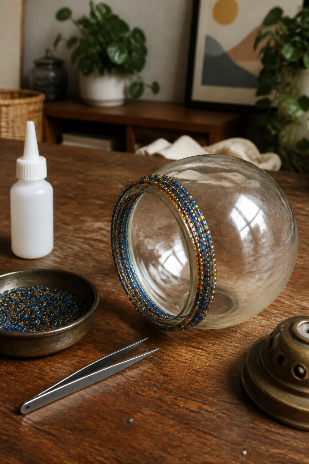 Glass globe with 6/0 seed beads arranged along its rim.