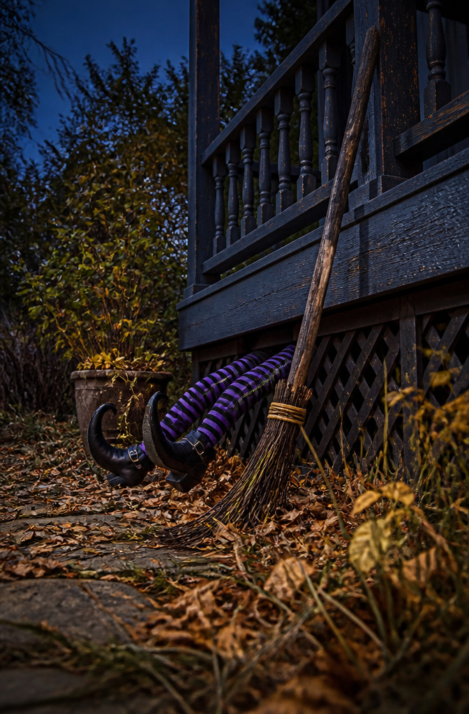 Striped stockings and shoes resembling witch legs partially hidden.