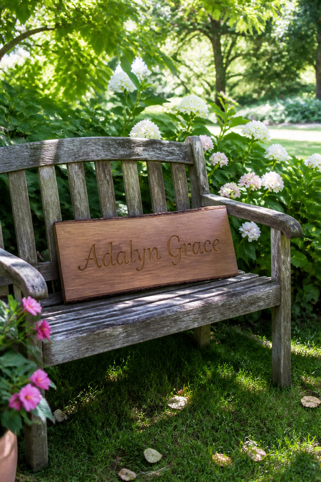 Middle Names for Adalyn: 40 Ideas That Flow 2 A wooden plaque displaying the name Adalyn Grace in a garden.